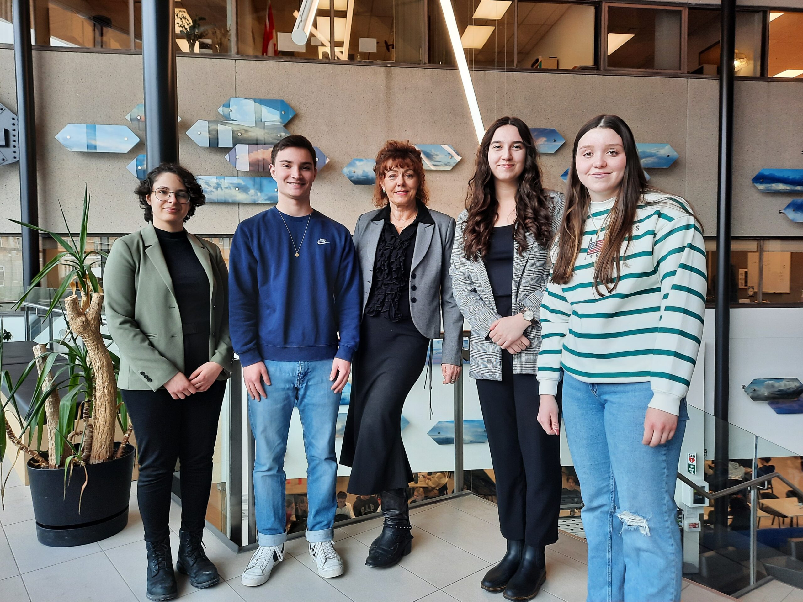 Professor Lisa Birch (centre), pictured with Sami Benmahbous, Arthur Zimmerman, Andrea Martinez Ortiz, and Isabelle Gagnon, each of whom is researching political science and public policy.